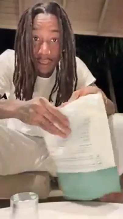 Wiz Khalifa unboxing flower on camera